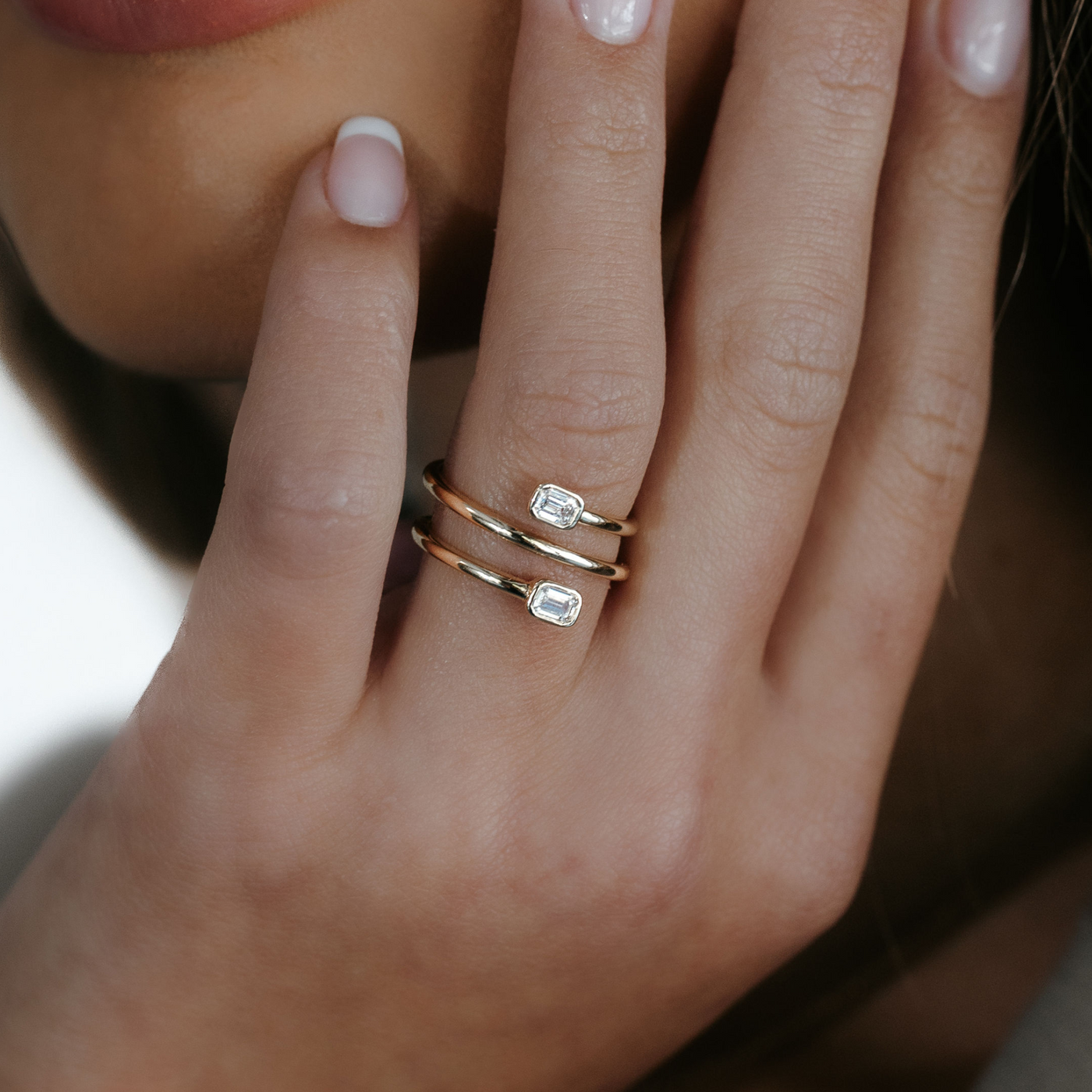 emerald cut diamond and gold spiral ring