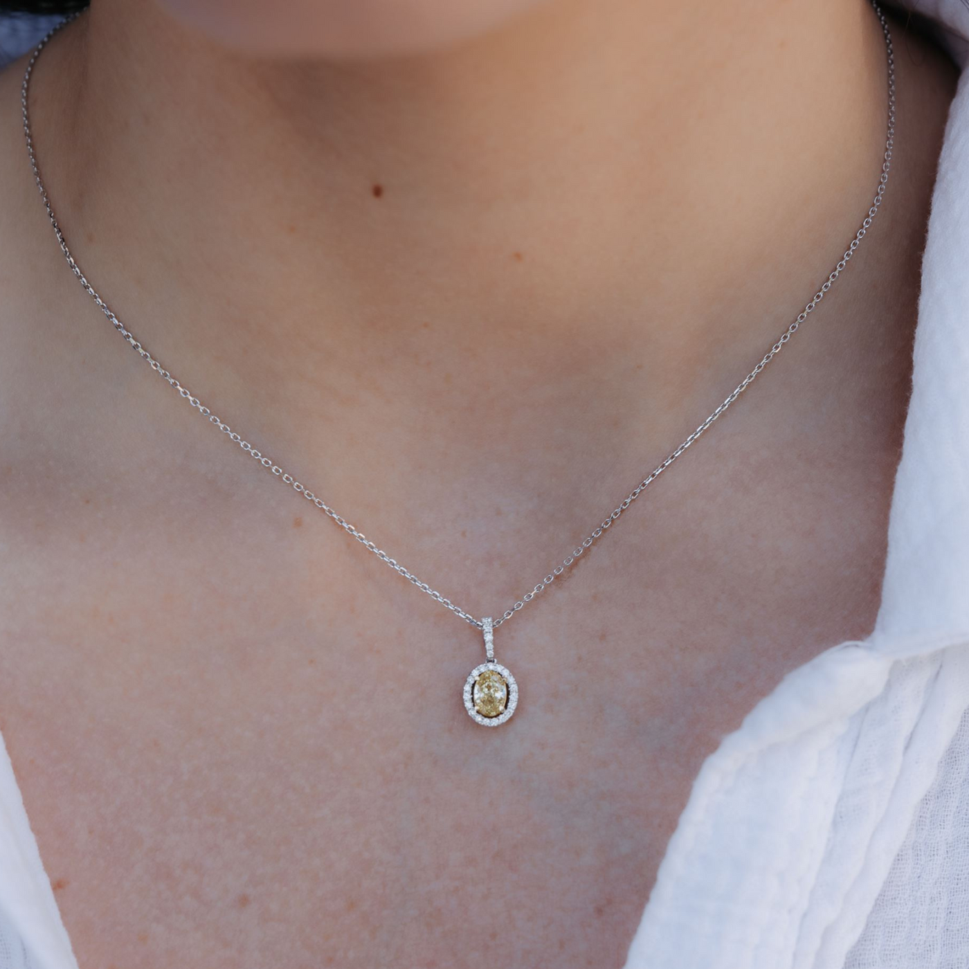 Oval Shaped Yellow Diamond Halo Necklace