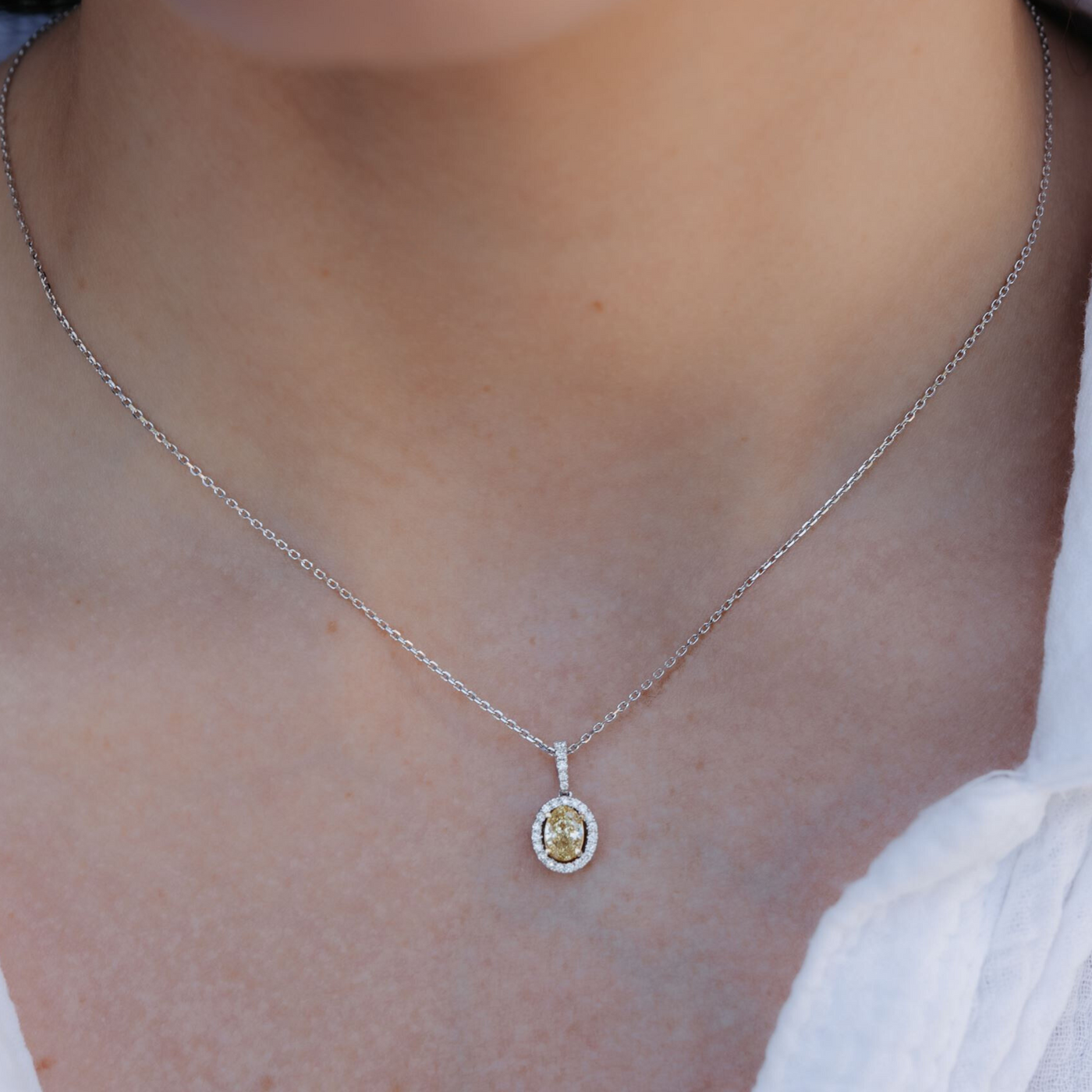 yellow and white diamond halo necklace